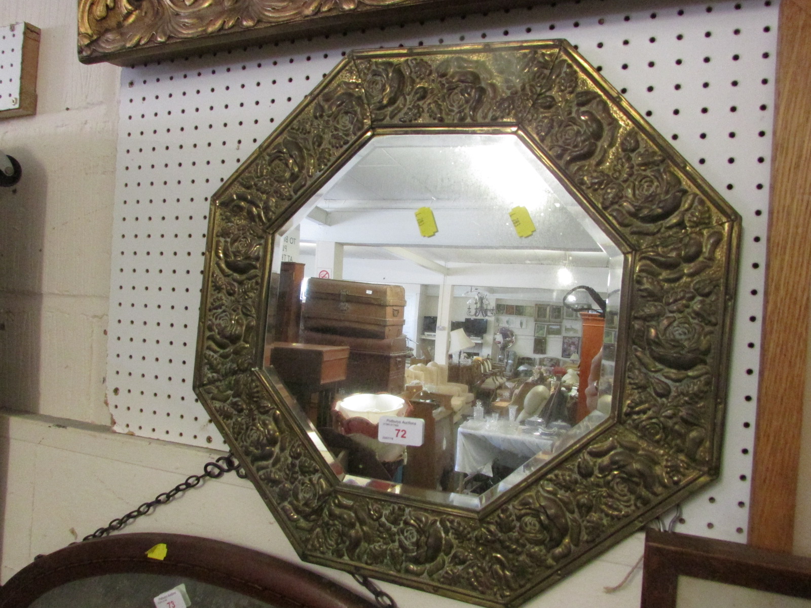 OCTAGONAL BEVEL EDGED WALL MIRROR IN EMBOSSED BRASS FRAME