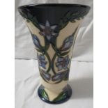 Moorcroft pottery Kaffir Lily two star members vase with flared neck, cream ground, dark blue at