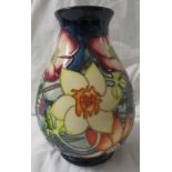 Moorcroft pottery QEII Golden Jubilee ovoid vase, dark blue ground, tube lined decoration of