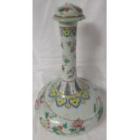 A Chinese porcelain bottle vase with stopper, celadon ground, enamelled in the famille rose