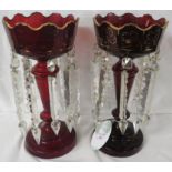 A pair of Victorian gilded ruby glass lustres with cut glass prism pendants