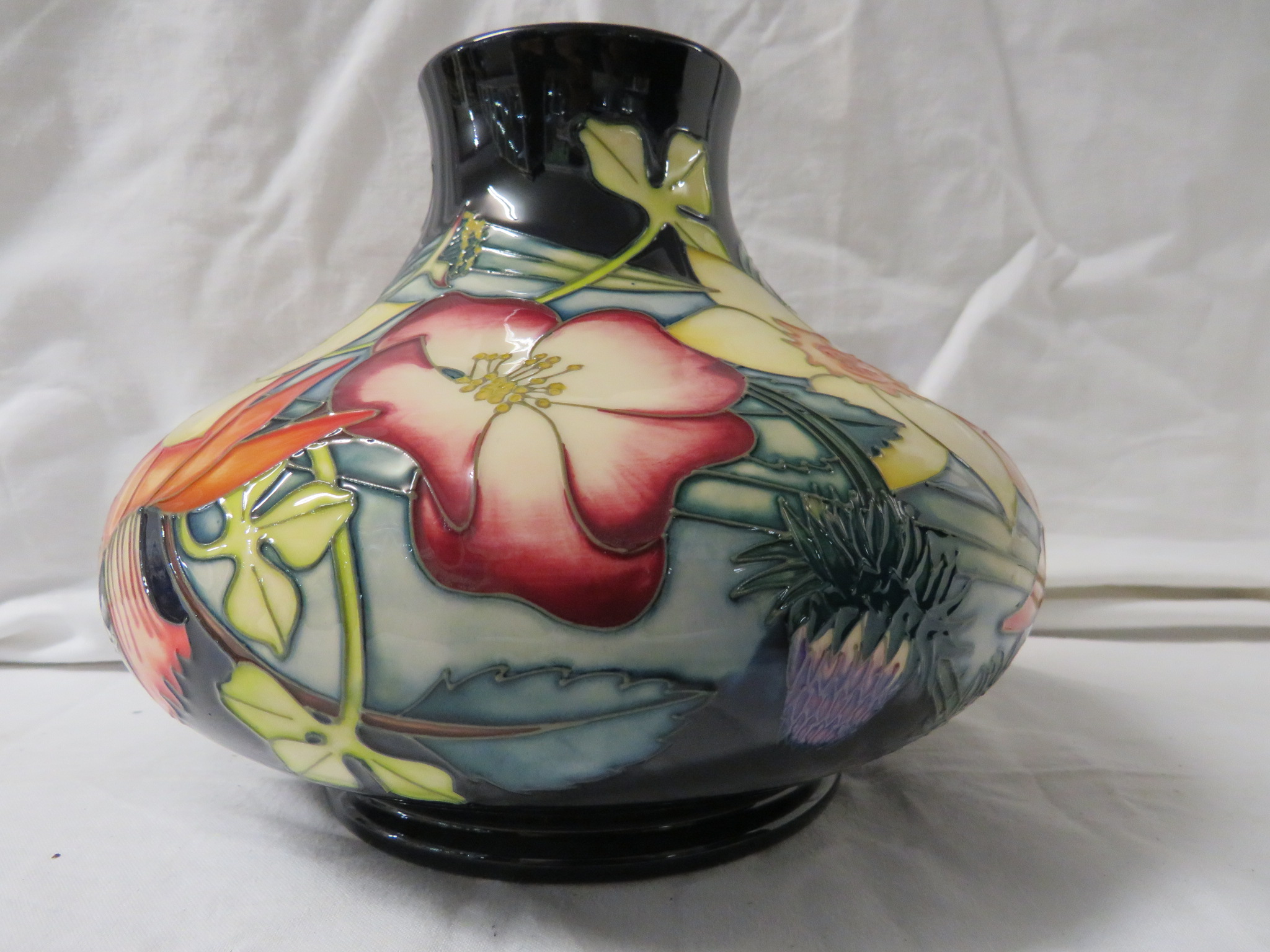 Moorcroft pottery QEII Golden Jubilee large squat vase, dark blue ground, tube lined decoration of - Image 3 of 5