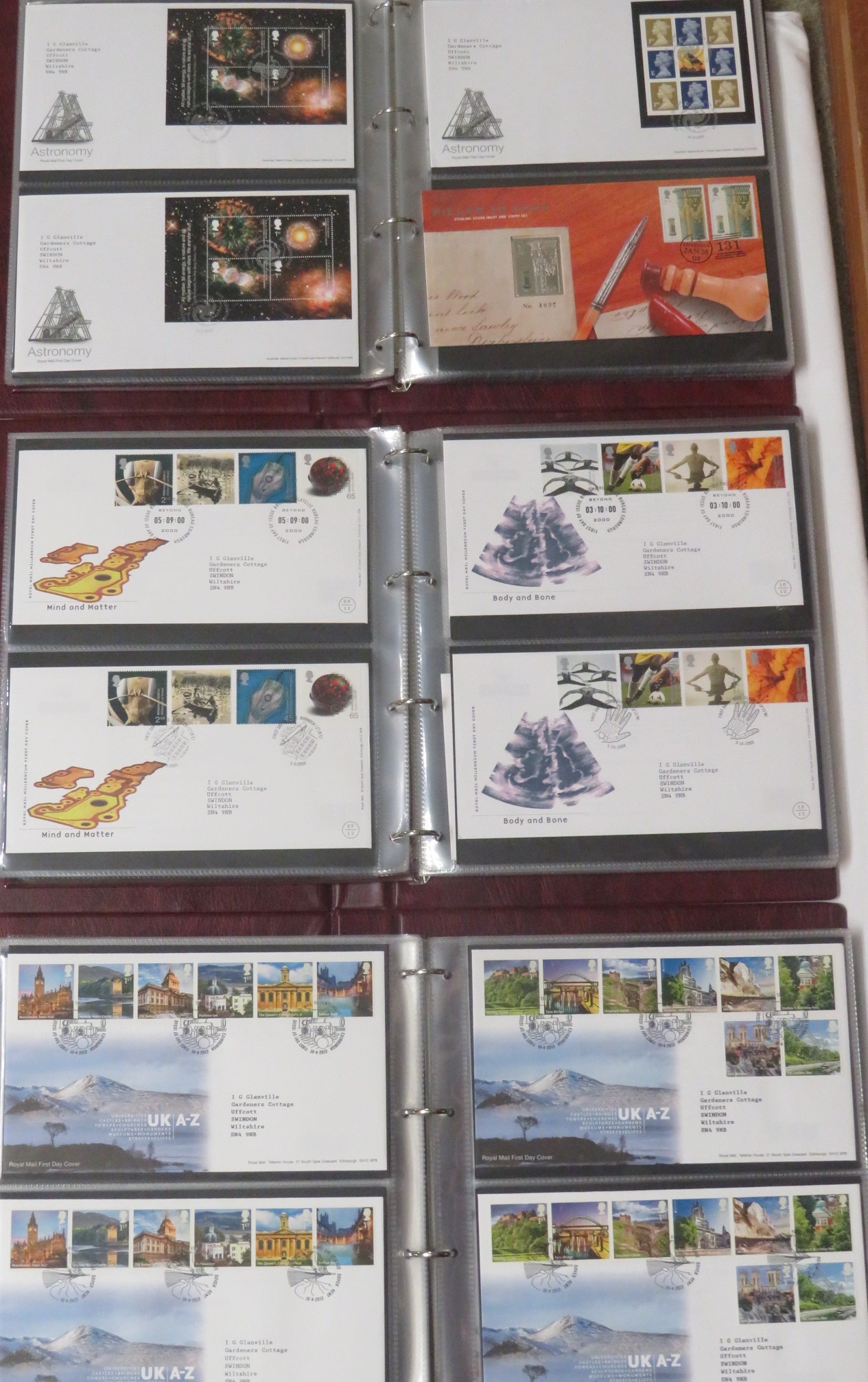 Seven Royal Mail First Day Covers maroon albums with fifty-eight covers 2000-2001, sixty-one