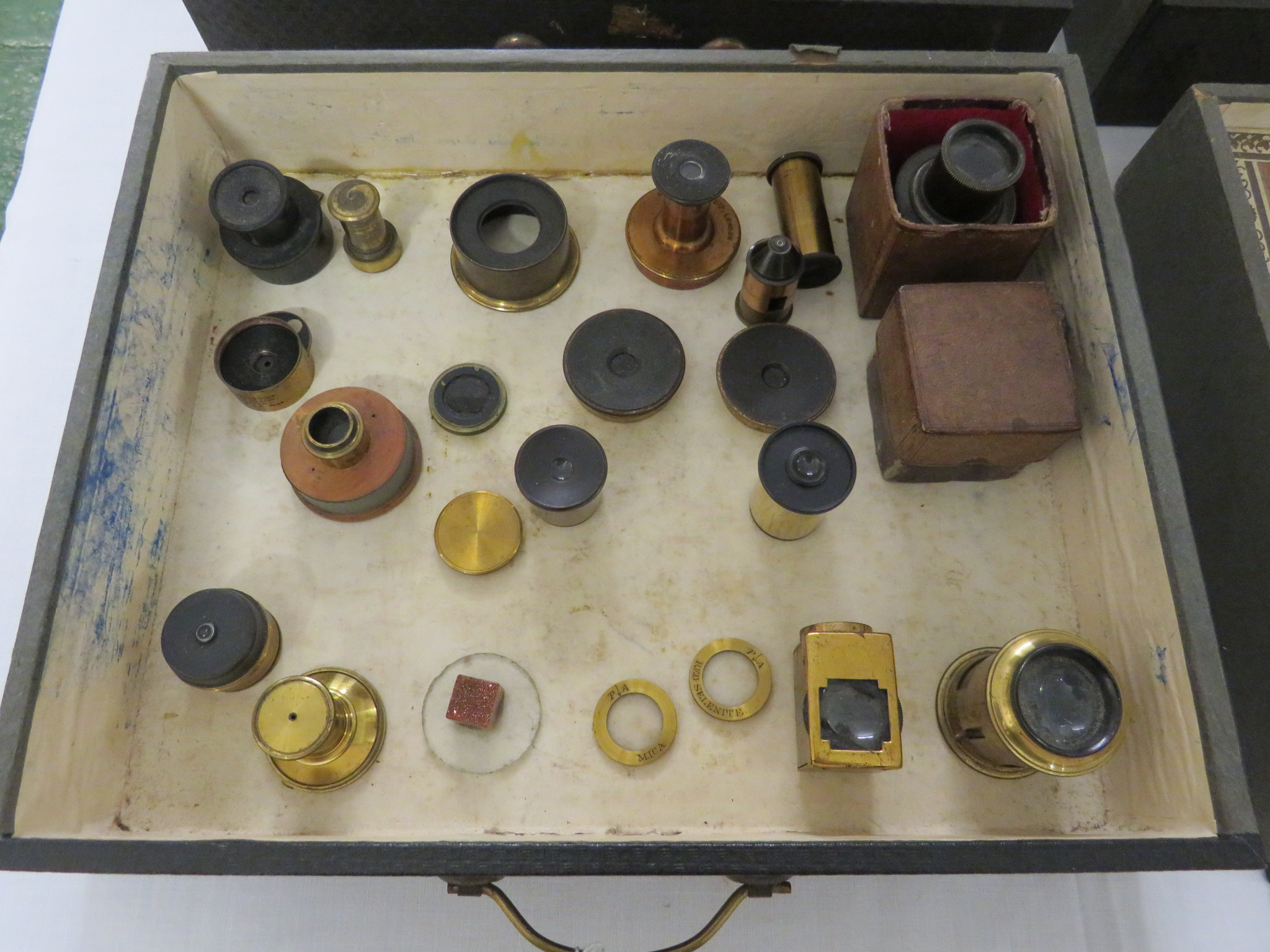 An assortment of optical components including gun sight parts contained in a vintage Advance 'The - Image 2 of 5