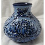 Moorcroft pottery small squat vase in the style of Macintyre Florian ware, pale blue ground with