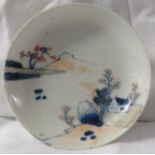 A small Japanese porcelain dish painted with landscape in blue and red, diameter 11.5cm