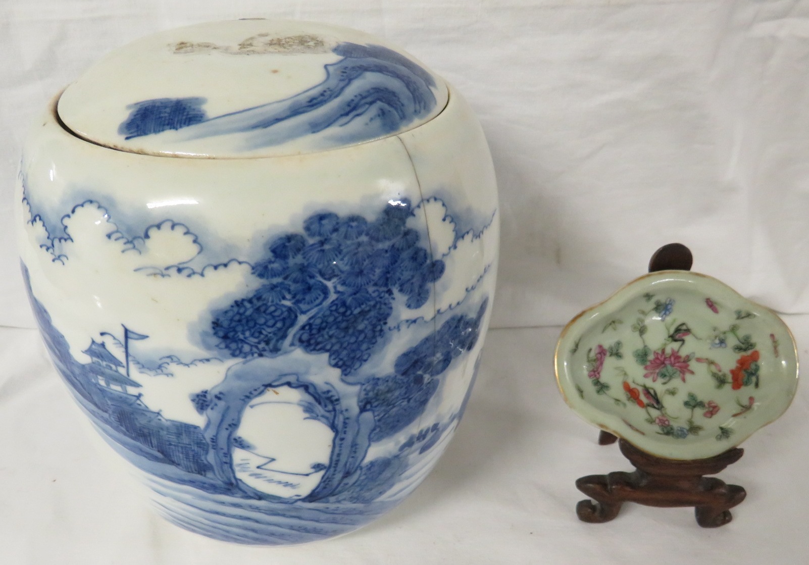 A Chinese porcelain ovoid jar painted in underglaze blue with landscape with figures, height 17cm,