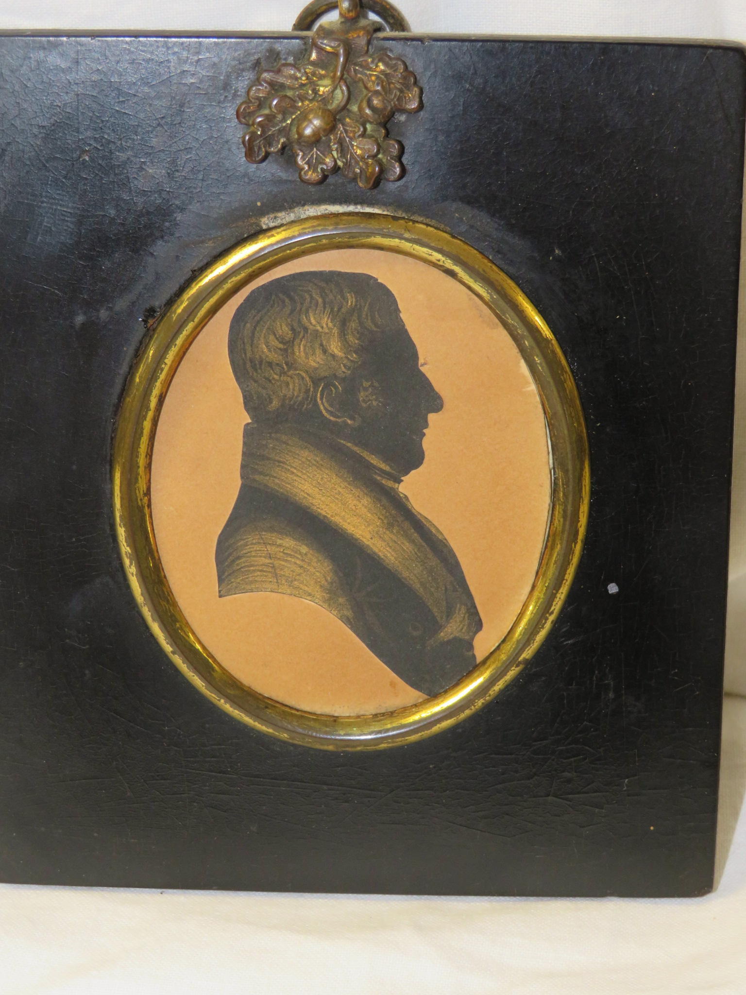 Painted oval portrait miniature of gentleman, head and shoulders enhance silhouette, signed to