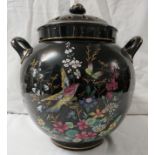 A large ovoid china pot pourri, black ground, transfer and painted enamel decoration of birds