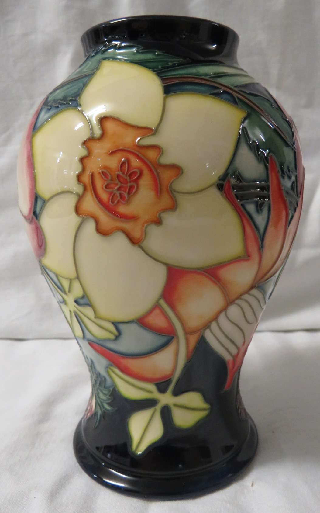 Moorcroft pottery QEII Golden Jubilee baluster vase, dark blue ground, tube lined decoration of