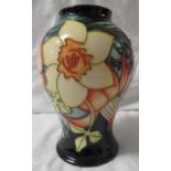 Moorcroft pottery QEII Golden Jubilee baluster vase, dark blue ground, tube lined decoration of