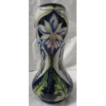 Moorcroft pottery Meadow Star baluster vase with bulbous neck, dark blue ground, tube lined