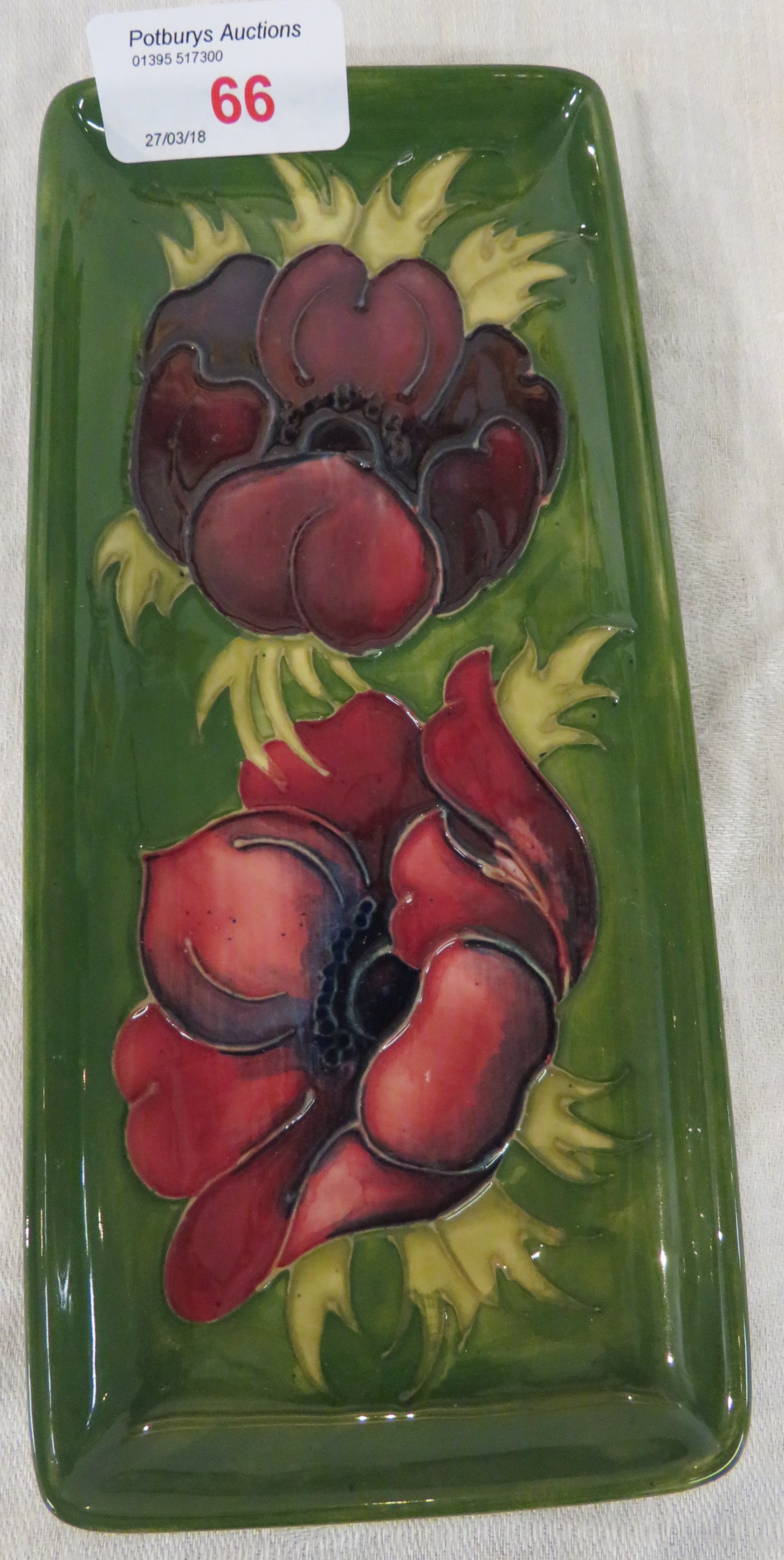 Moorcroft pottery oblong dish, green ground, tube lined decoration of crimson poppies, stamped MOOR