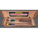 A late 20th century Jaques part croquet set in pine box (contains four mallets, three balls and