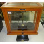 Griffin & George microid balance scales in glazed cabinet, with a box of weights