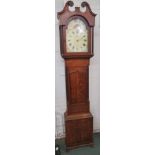 A 19th century thirty hour long case clock with hand painted enamel dial and floral spandrels signed