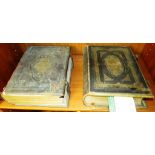 TWO VICTORIAN FAMILY BIBLES, EACH IN TOOLED GILT LEATHER BINDINGS WITH BRASS CLASPS