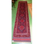 HAND KNOTTED WOOLEN MESHWANI RECTANGULAR FLOOR RUNNER, RED GROUND WITH FIVE MEDALLIONS (260X62CM)