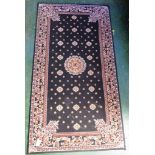 SMALL BLACK GROUND PATTERNED FLOOR RUG