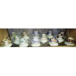 THIRTEEN 19TH CENTURY DECORATIVE TEACUPS AND SAUCERS