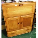 ERCOL LIGHT ELM DRINKS CABINET WITH FALL FRONT COMPARTMENT TO TOP AND TWO CUPBOARD DOORS OVER SINGLE