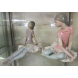 TWO LLADRO FIGURINES OF SITTING BALLERINAS