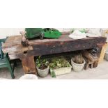 LARGE RUSTIC FARM WORKSHOP BENCH WITH VICE, TOGETHER WITH PIPE BENDER MOUNTED ON WOODEN STAND (A/F)