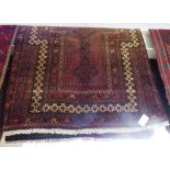 SMALL HAND KNOTTED WOOLLEN FLOOR RUG WITH TASSELLED ENDS (134CM X 72CM)