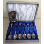 CASED SET OF HONG KONG SILVER TEASPOONS AND WHITE METAL EGG CUP