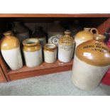 SELECTION OF STONEWARE FLAGONS, BOTTLES AND JARS (SOME WITH COMMERCIAL NAMES INCLUDING GILBY,