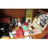 SHELF OF VINTAGE ITEMS INCLUDING BROWNIE CAMERA, PLAYING CARDS, VINYL RECORDS, COMMERCIAL TINS,