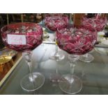 FOUR COLOURED CUT GLASS DECORATIVE STEMMED GLASSES