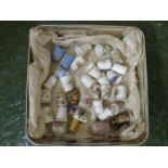 TIN OF ASSORTED CERAMIC AND METAL THIMBLES INCLUDING ROYAL ALBERT AND WEDGWOOD