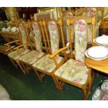 ERCOL LIGHT ELM EXTENDING TRESTLE DINING TABLE AND EIGHT CHAIRS INCLUDING TWO CARVERS WITH FLORAL