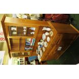 ERCOL LIGHT ELM DRESSER WITH TWO GLAZED DOORS AND SHELVES TO TOP AND FOUR DOORS AND DRAWERS TO BASE