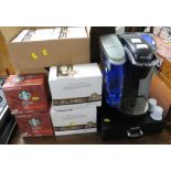 KEURIG FILTER COFFEE MAKER AND BOXES OF ASSORTED COFFEE PODS