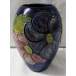 William Moorcroft pottery ovoid vase, blue ground with mauve flowers and green leaves, height