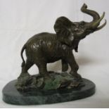 A lacquered brass model of an elephant on a naturalistic base, marked (C) and initialled SPI, on