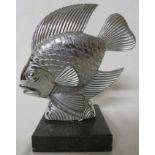 A nickel plated car mascot modelled as a goldfish, mounted on a black marble plinth, overall