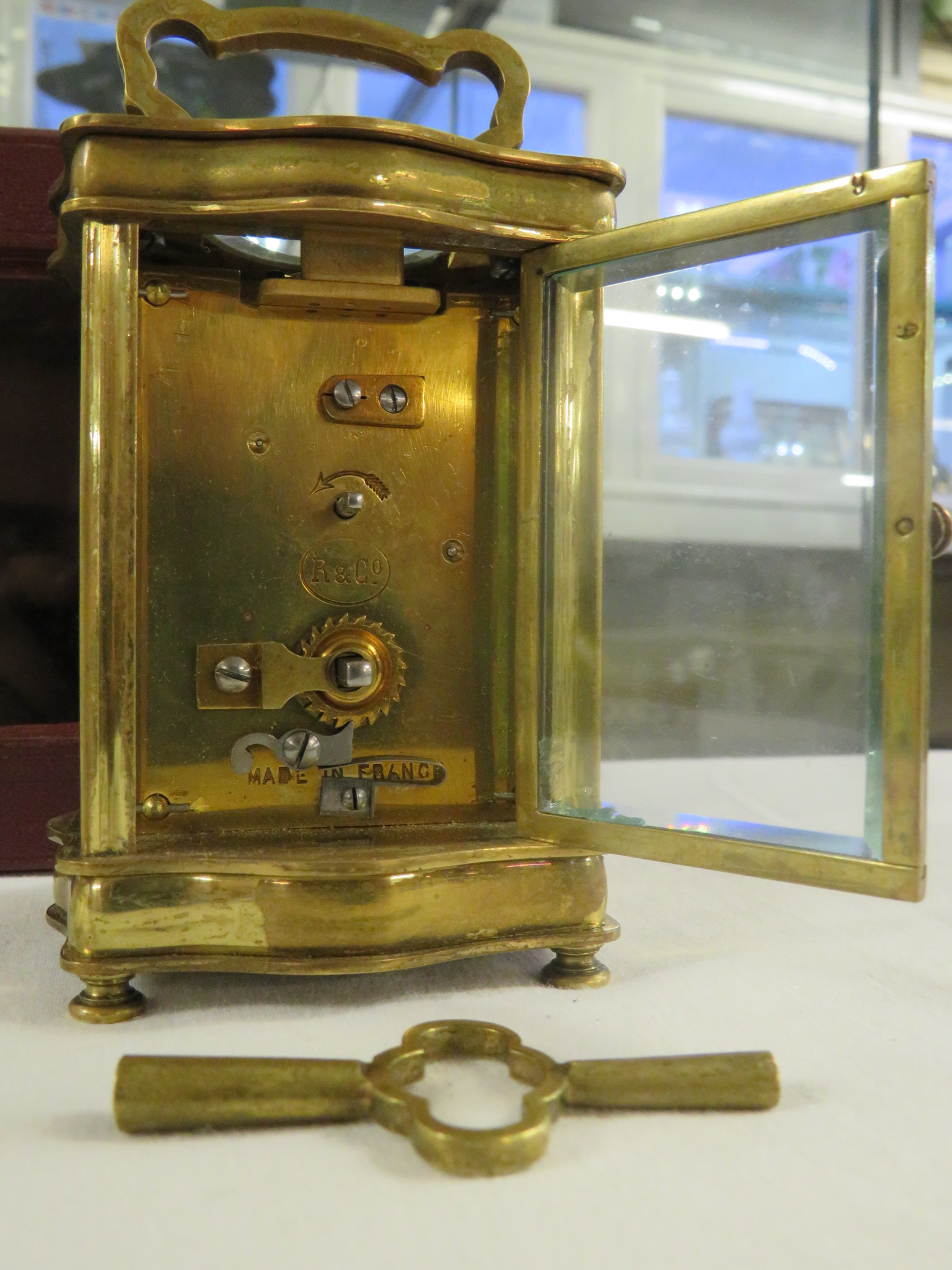 A brass serpentine cased carriage clock raised on bun feet, the dial signed Cooper Worcester, the - Image 4 of 4