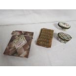 Mother of pearl inlaid card case, fragments of a cloth book binding, and two porcelain pill pots