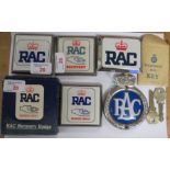 Two rectangular RAC badges, two RAC Recovery badges (one with box), a plastic circular RAC badge,