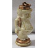 Miniature carved figural pendant of man with umbrella, 4cm