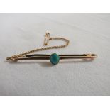 Bar brooch with cabouchon turquoise, yellow metal stamped 15CT, length 51mm, gross weight with