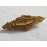 Victorian 9 carat gold mourning brooch, oval, 49mm x 18mm, set centrally with a very small