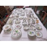 A large Portmeirion Botanic dinner and tea service including flan dishes, bowls, serving dishes etc,