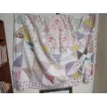 Large early 20th century patchwork quilt of triangular floral design (203cm x 268cm)