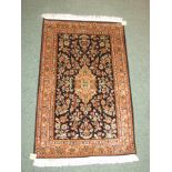 Kashmir part silk hand made rug with floral design in salmon and beige colours, 96cm x 62cm