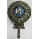 Royal Automobile Club Associate badge with spoked wheel and blue and white enamel lozenge device,