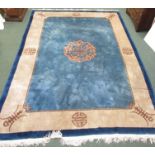 Late 20th century Chinese style embossed rug, blue ground with Chou mark device to the centre, a